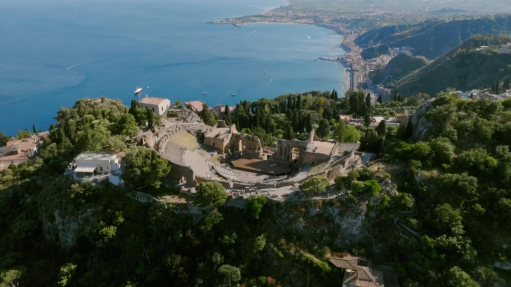 Aerial view of Taormina in Sicily with the Greek Theatre and the bay, location of Lauren and Alex wedding
