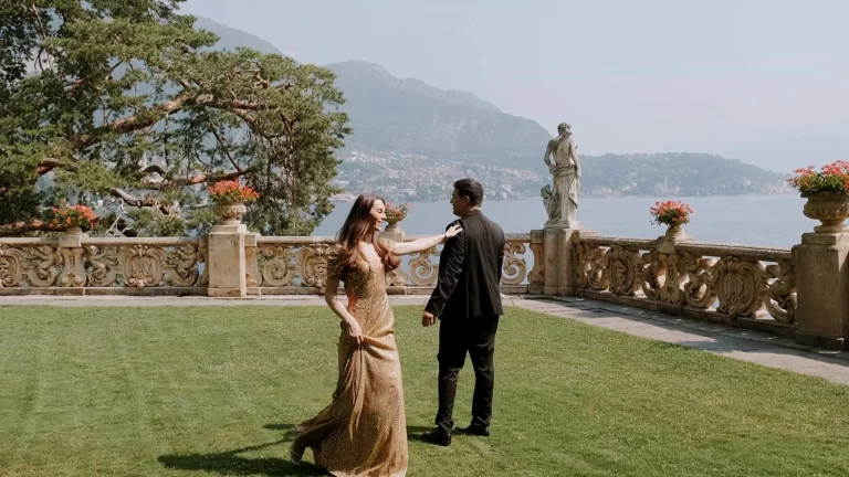Couple dancing on the lawn of Villa del Balbianello on Lake Como after the proposal